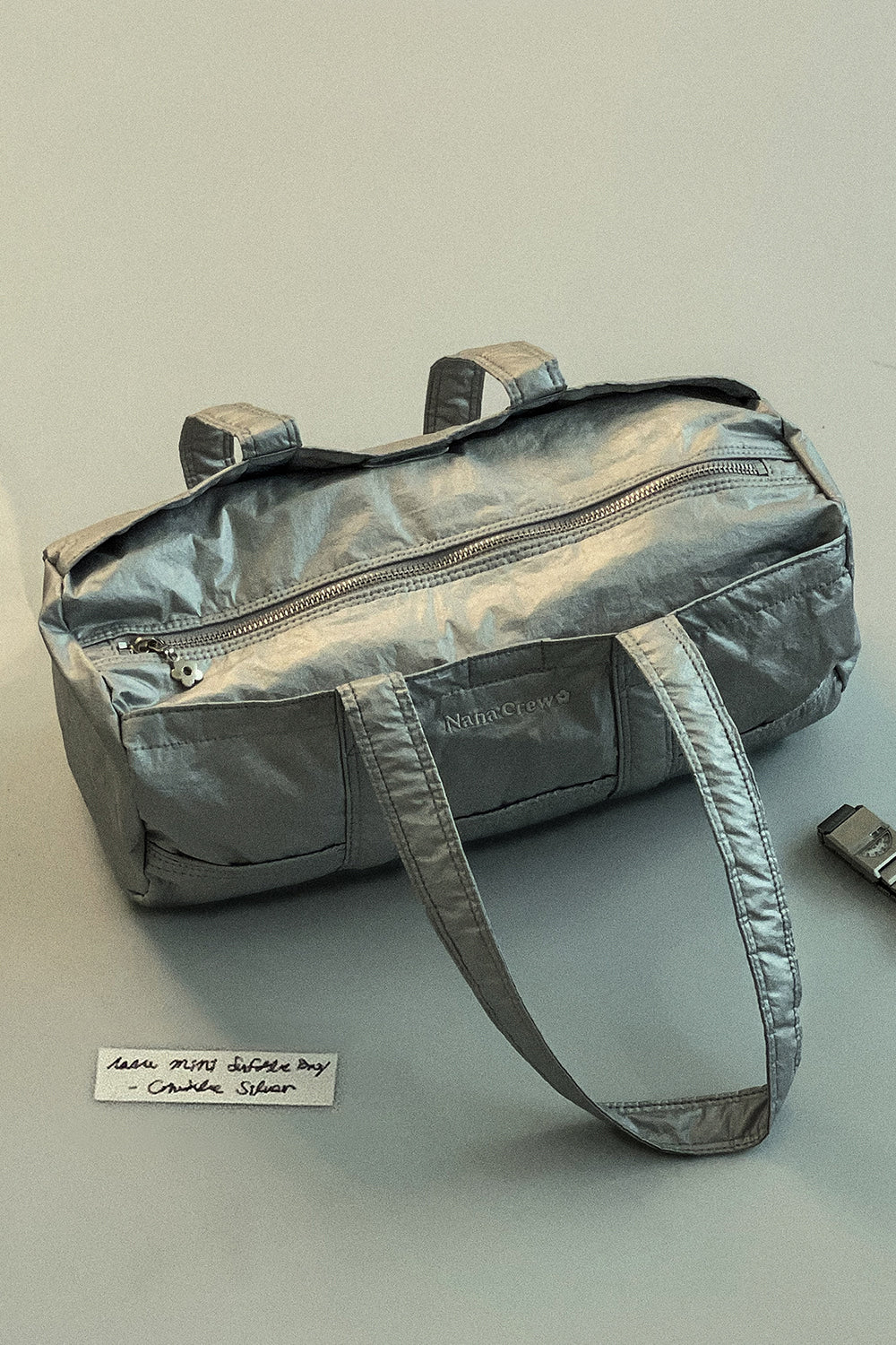 nana-crew-ss-24-nana-mini-duffle-bag-crinkle-silver